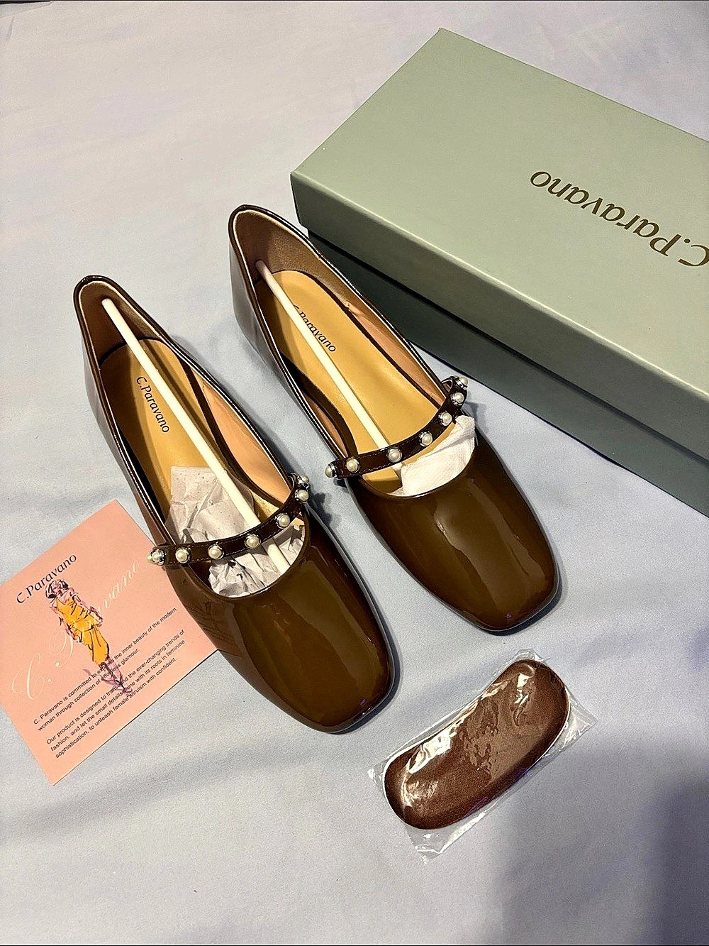 C. Paravano Embellished Brown Flats